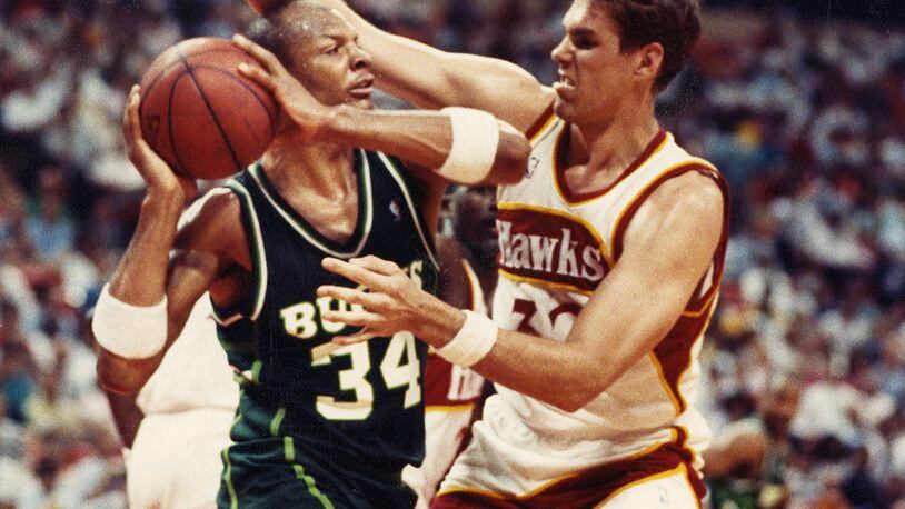Jon Koncak of the Hawks defends against Terry Cummings during the playoffs in 1989. William Berry / AJC file photo