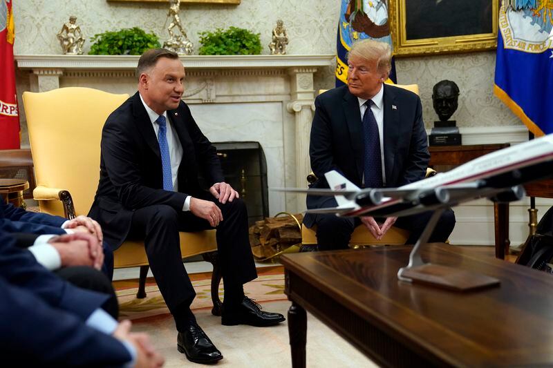 FILE - President Donald Trump meets with Polish President Andrzej Duda in the Oval Office of the White House, June 24, 2020, in Washington. Trump is set to meet with Polish President Andrzej Duda in New York as Trump's criminal trial takes a one-day break. Their planned dinner Wednesday comes as European leaders prepare for the possibility Trump might win the White House in November. (AP Photo/Evan Vucci, File)