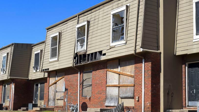 Broken windows and missing siding are a common sight at the Forest Cove apartment complex. A fatal shooting Tuesday night is the latest in a string of violent incidents at the condemned complex.