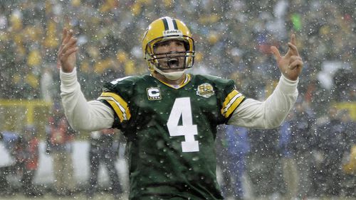 Green Bay Packers quarterback Brett Favre reacts after throwing a 15-yard touchdown pass to Greg Jennings during the first half of an NFL divisional football playoff game against the Seattle Seahawks, Saturday, Jan. 12, 2008, in Green Bay, Wis. (AP Photo/Morry Gash)
