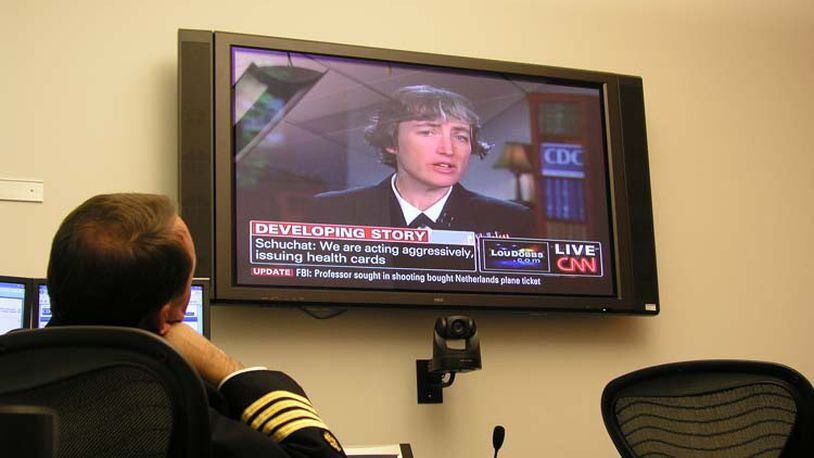Dr. Anne Schuchat appears on CNN to give updates to the public during the 2009 H1N1 pandemic, while Daniel Jernigan, leader of the Epidemiology and Laboratory Task Force, watches. During the pandemic, Schuchat acted as the face of the CDC, keeping the public up to date on the evolving situation. CENTERS FOR DISEASE CONTROL AND PREVENTION