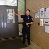 Gwinnett County Public Schools Police Chief Tony Lockard demonstrates the district’s new front entrance security and sign-in system at Collins Hill High School in Suwanee on Friday, July 22, 2022. (Arvin Temkar / arvin.temkar@ajc.com)