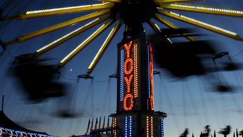 Fairgoers take a ride on the YoYo chair swing ride at the Georgia National Fair in Perry. (Morgan Phillips / UGA Photojournalism workshop)