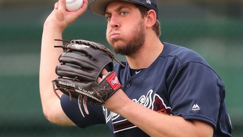 Braves pitcher Aaron Blair looks to throw during a spring training workout on Feb. 15. Curtis Compton/ccompton@ajc.com