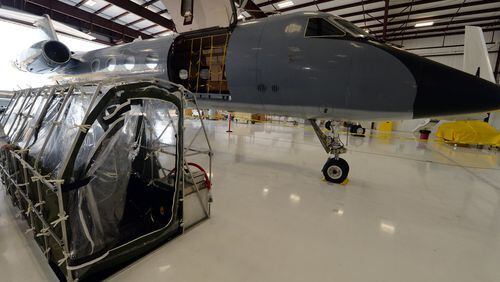Phoenix Air’s Aeromedical Biological Containment System sits alongside the Gulfstream G3 aircraft that made both flights to Liberia. The containment pod in the photo is a test unit; the actual units used to fly the Ebola patients were incincerated after a single use. KENT D. JOHNSON/KDJOHNSON@AJC.COM