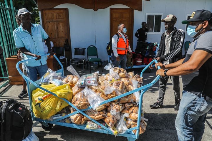 Bags of donated bread arrive at Cayes Airport in Les Cayes, Haiti, on Sunday, Aug, 15, 2021. (Valerie Baeriswyl/The New York Times)