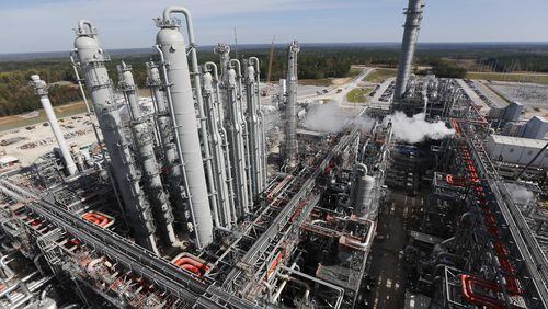 Southern Co. said its net income dropped in the fourth quarter, largely because of losses at its Kemper “clean coal” plant in Mississippi, shown here. (AP Photo/Rogelio V. Solis, File)