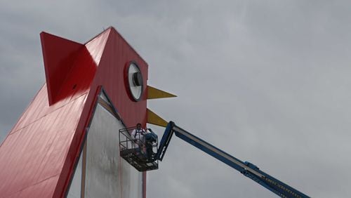 Marlon Ramirez paints  the Big Chicken in Marietta, Georgia, on Wednesday. It's undergoing its first real renovation in years.
