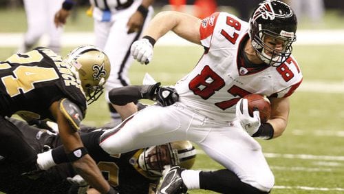 Falcons tight end Justin Peelle is dragged down after his one catch of the day for 9 yards.