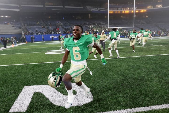 Buford's Victor Venn (6) celebrates after Langston Hughes missed the field goal attempt as Buford won 21-20 as time expires during the Class 6A state title football game at Georgia State Center Parc Stadium Friday, December 10, 2021, Atlanta. JASON GETZ FOR THE ATLANTA JOURNAL-CONSTITUTION