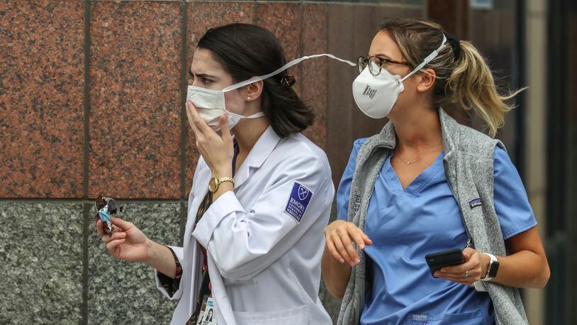 Medical workers arrive at Grady Hospital in downtown Atlanta on Thursday, July 9, 2020. Local hospitals are seeing a surge in new patients as cases reach record highs in Georgia. JOHN SPINK/JSPINK@AJC.COM