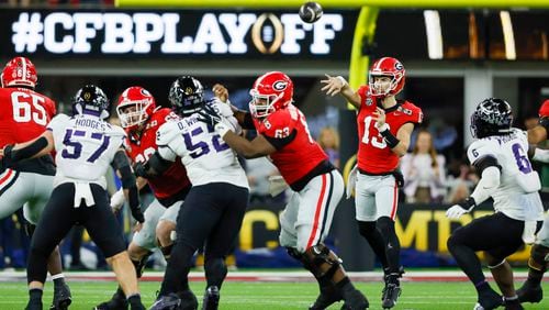 Georgia Bulldogs quarterback Stetson Bennett (13) throws against the TCU Horned Frogs during the second half of the College Football Playoff National Championship at SoFi Stadium in Los Angeles on Monday, January 9, 2023. Georgia won 65-7 and secured a back-to-back championship. (Jason Getz / Jason.Getz@ajc.com)