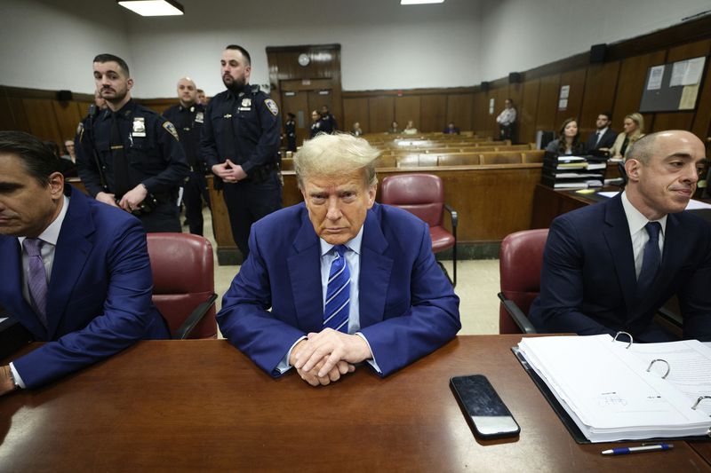 FILE - Former President Donald Trump waits the start of proceedings on the second day of jury selection at Manhattan criminal court, April 16, 2024, in New York. The jury selection process underway at the historic criminal trial of Trump can already credit modern technology for shaping the eventual panel. (Curtis Means/DailyMail.com via AP, Pool)