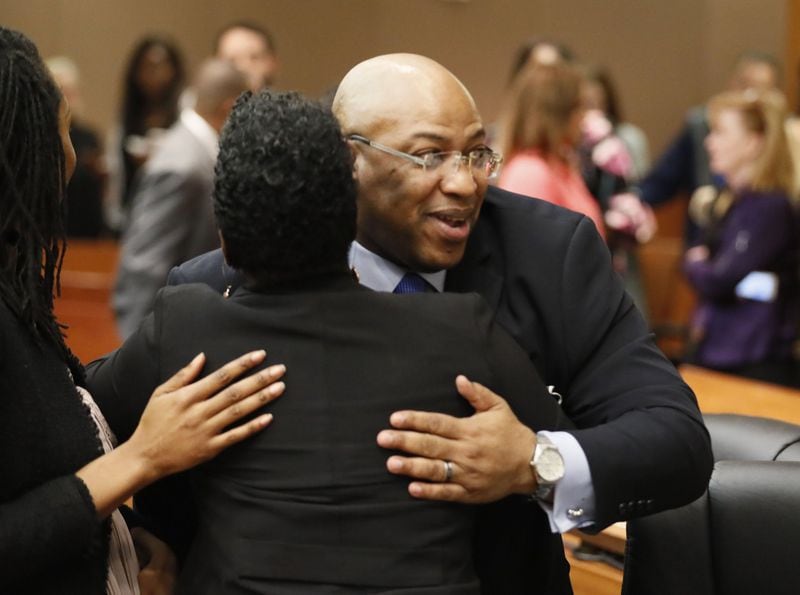 Chief Assistant District Attorney Clint Rucker receives a congratulatory hug after the verdict. The jury found Tex McIver guilty on four of five charges on their fifth day of deliberations. Bob Andres / bandres@ajc.com