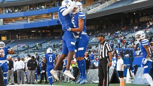 Georgia State wide receiver Sam Pinckney (right) celebrates a touchdown pass with a teammate in a game against Troy at Center Parc Stadium on Nov. 27, 2021. (Photo by Todd Drexler/Sideline Sports)