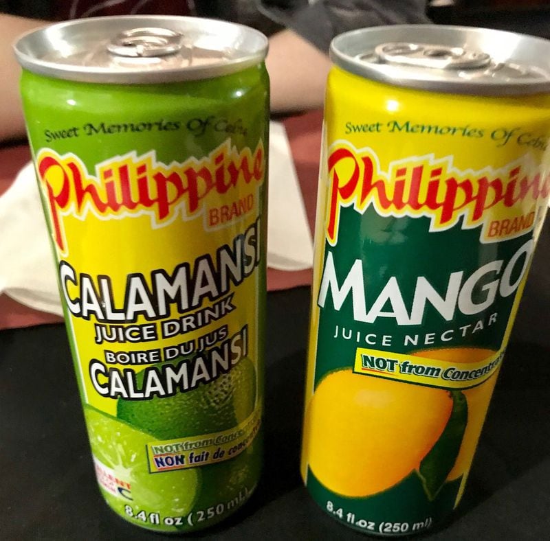 Filipino and soul food restaurant Janet’s Kitchen offers a couple of canned Filipino beverages, including calamansi and mango juice. LIGAYA FIGUERAS / LFIGUERAS@AJC.COM