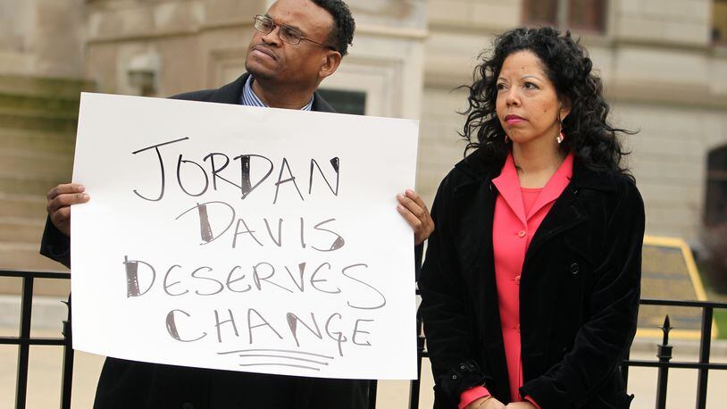 February 26, 2013 - Atlanta, Ga: Lucia McBath, the mother of shooting victim Jordan Davis, right, stands next to Quincy Harris, of Atlanta, before McBath spoke at a Gun Control Rally on the west side steps of the Capitol Tuesday afternoon in Atlanta, Ga., February 26, 2013. Jordan Davis was killed in Florida last year after a dispute over loud music. The man accused of the crime is claiming his defense around the controversial "Stand Your Ground" law. JASON GETZ / JGETZ@AJC.COM