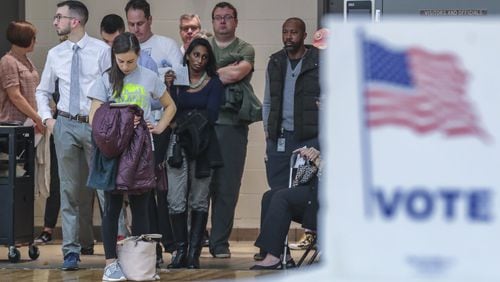 Voters waited over an hour to vote at Henry W. Grady High School in Atlanta on Tuesday. JOHN SPINK / JSPINK@AJC.COM