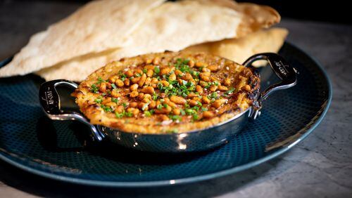Wood-Fired Hummus with charred sweet onion, toasted pine nuts and lavash. 
Mia Yakel for The Atlanta Journal-Constitution