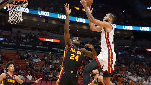 Miami Heat forward Caleb Martin drives to the basket as Hawks center Johnny Hamilton (24) defends during the second half of a preseason NBA game, Monday, Oct. 4, 2021, in Miami. (Marta Lavandier/AP)