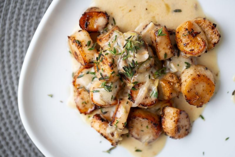 Chef Issa Prescott says he thinks lemongrass doesn't get the attention it deserves. Here, it plays a role in King Trumpet Mushroom Scallops with Lemongrass Bechamel. (Ryan Fleisher for The Atlanta Journal-Constitution)