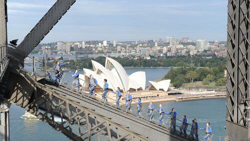 Scale the heights of Sydney’s Harbour Bridge, rising about a mile above the water and offering sweeping views of the city and its iconic landmark, the Sydney Opera House. Contributed by BridgeClimb Sydney