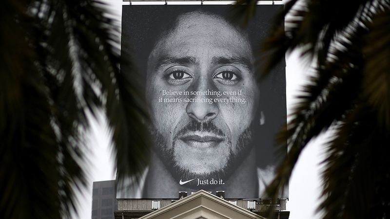 A billboard featuring former San Francisco 49ers quaterback Colin Kaepernick is displayed on the roof of the Nike Store on September 5, 2018 in San Francisco, California. Nike launched an ad campaign to commemorate the 30th anniversary of its iconic 'Just Do It' motto that features controversial former NFL quarterback Colin Kaepernick and a message that says 'Believe in something. Even if it means sacrificing everything.'