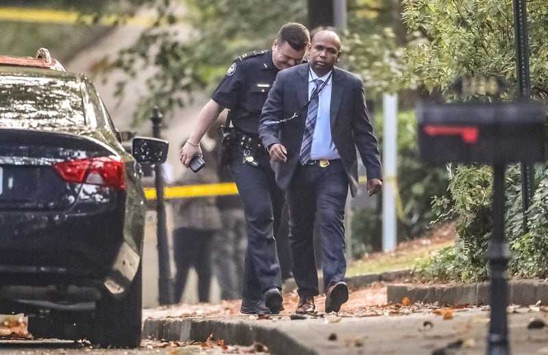 Atlanta police homicide commander Lt. Germain Dearlove arrives on the scene of an investigation Thursday morning at a home in the 1200 block of Peachtree Battle Avenue.