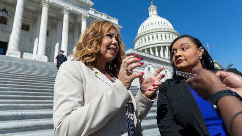 U.S. Rep. Lucy McBath, left, and U.S. Rep. Nikema Williams speak to a reporter after an event in Washington marking the one-year anniversary of the Atlanta spa shootings. McBath is a key member on the House Judiciary Committee when it discusses gun policy.