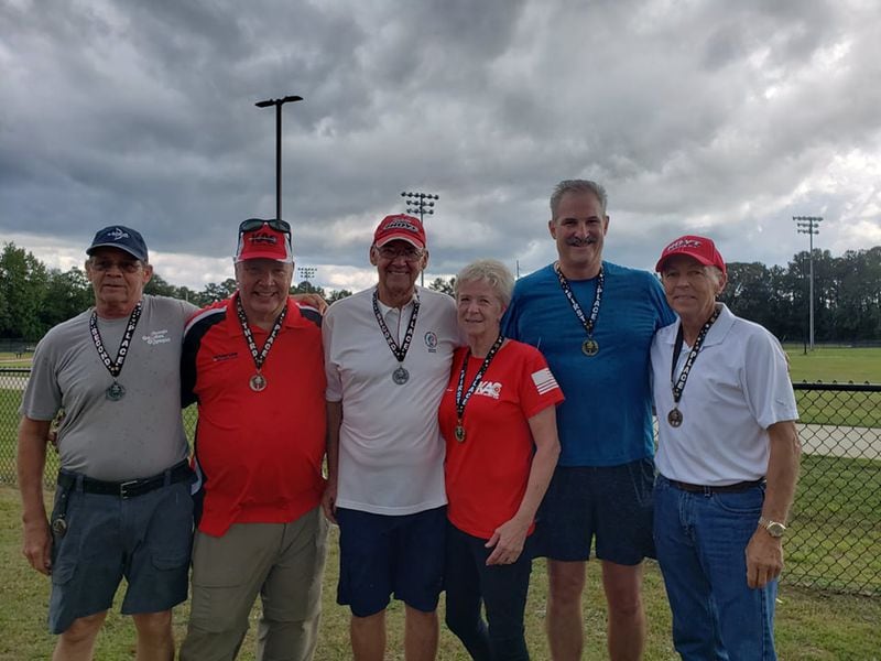 Kennesaw archers at the Georgia Golden Olympics in Warner Robins last September. From left: David Gran, Chris Tackett, Don Edwards, Heather Polk, Tom Piacentini and Mike Scott.