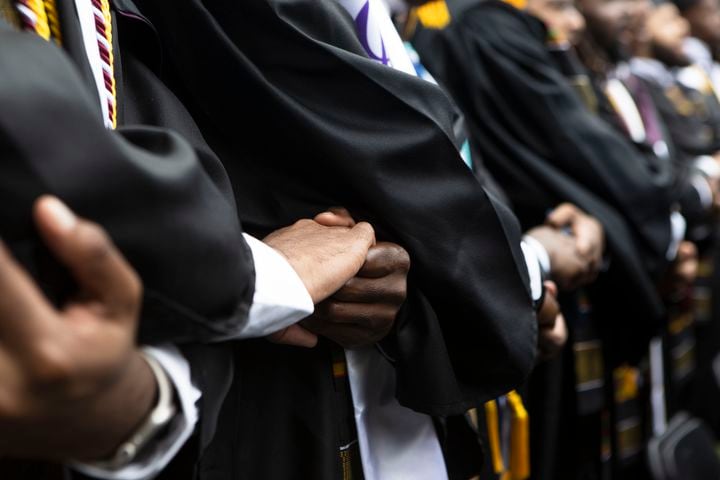 Members of the Morehouse Class of 2023 sing their college anthem during the Morehouse College commencement ceremony on Sunday, May 21, 2023, on Century Campus in Atlanta. The graduation marked Morehouse College's 139th commencement program. CHRISTINA MATACOTTA FOR THE ATLANTA JOURNAL-CONSTITUTION