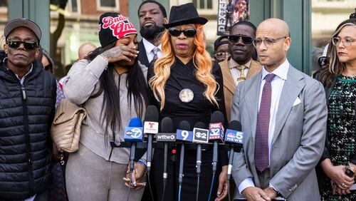FILE - Flanked by family members, attorneys and supporters, Dexter Reed's mother, Nicole Banks, speaks to reporters outside the headquarters for the Civilian Office of Police Accountability in West Town, Chicago, April 9, 2024. The family of the Chicago man killed during a traffic stop where plainclothes police officers fired their guns nearly 100 times filed a wrongful death lawsuit Wednesday, April 24, 2024 accusing the department of “brutally violent” policing tactics. (Ashlee Rezin /Chicago Sun-Times via AP, file)