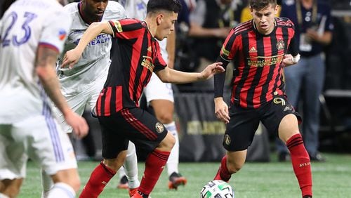 Atlanta United midfielders Ezequiel Barco (left) and Matheus Rossetto work against FC Cincinnati during a 2-1 victory in a MLS soccer match on Saturday, March 8, 2020, in Atlanta.   Curtis Compton ccompton@ajc.com