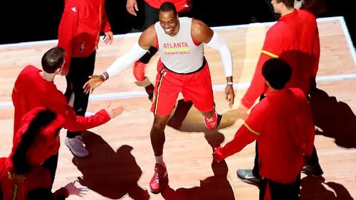 Dwight Howard is greeted by teammates taking the floor to play the Bucks in a NBA basketball game on Sunday, Jan. 15, 2017, in Atlanta.     Curtis Compton/ccompton@ajc.com
