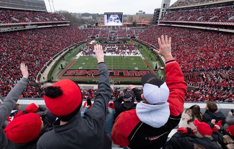 Fans cheer as UGA players enter the stadium for the National Championship celebration Saturday afternoon, Jan. 15, 2022, in Athens. Ben Gray for the Atlanta Journal-Constitution