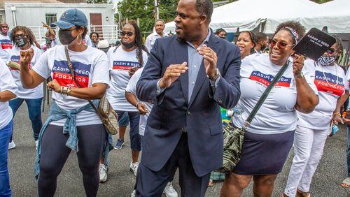 Former mayor Kasim Reed line dances with some of his volunteers at the opening of his new campaign headquarters in Atlanta Sunday, August 15, 2021.STEVE SCHAEFER FOR THE ATLANTA JOURNAL-CONSTITUTION