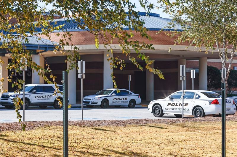 Views of multiple police cars parked at Norcross High School on Thursday, October 27, 2022. The school has increased police presence after a student was fatally shot near the campus. (Natrice Miller/natrice.miller@ajc.com)  