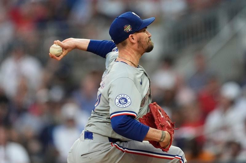Texas Rangers pitcher Andrew Heaney works the first inning of a baseball game against the Atlanta Braves Friday, April 19, 2024, in Atlanta. (AP Photo/John Bazemore)