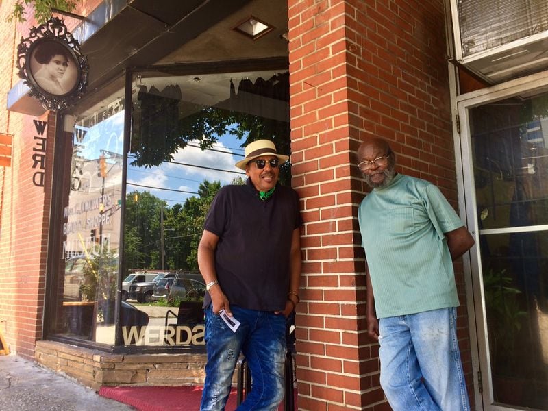 Ricci de Forest (left), a hairstylist who runs a museum and online radio station, says Auburn Avenue “looks like a giant cavity.” Standing with him is neighboring barber Seaborn Johnson. Photo by Bill Torpy