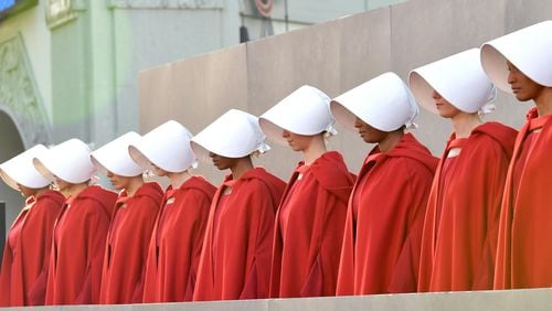 Handmaids are seen during the premiere of Hulu's "The Handmaid's Tale" Season 2 at TCL Chinese Theatre on April 19, 2018 in Hollywood, California.