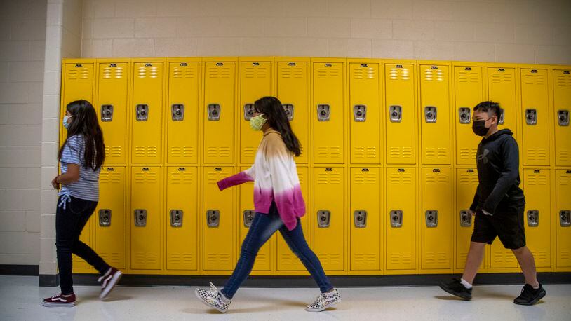 Students wearing face masks get a tour of their new school during the first day of school at Pearson Middle School in Marietta, Monday, August 2, 2021. (Alyssa Pointer/Atlanta Journal Constitution)