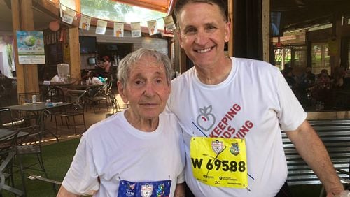 The oldest male runner in The AJC Peachtree Road Race, Lamar Perlis, and his close friend Dr. Peter Donnan after the 2018 race. (Tess DeMeyer/AJC)