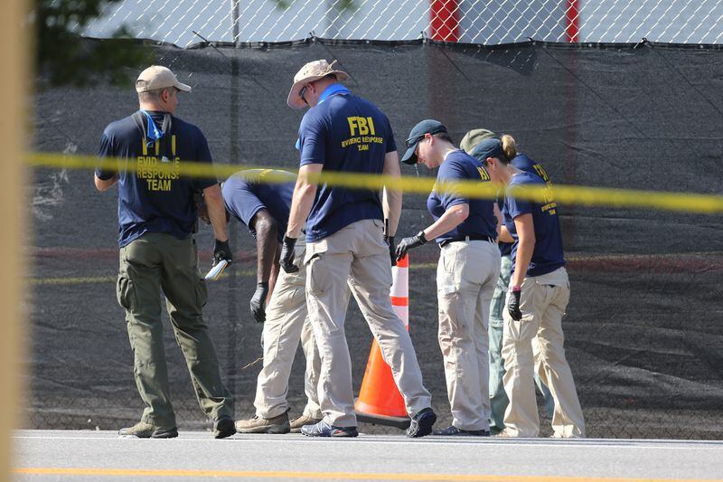About 50 people died and many more were wounded in the shooting spree. Investigators have numerous streets blocked off while they continue processing the scene. AJC photos: Curtis Compton