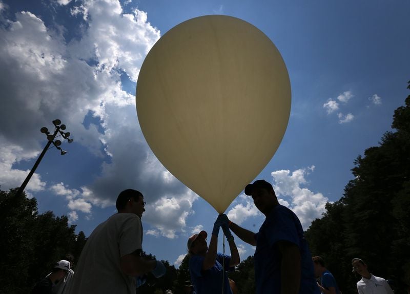 Georgia Tech students prepare to launch a balloon during the total solar eclipse at Ramah Darom, a Jewish summer camp facility in Rabun County. The launch was one of several eclipse related experiments funded by the National Science Foundation. (Curtis Compton/ccompton@ajc.com)