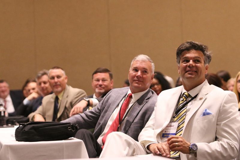 David Curry, Commissioner of the State Department of Revenue and the former Henry County tax commissioner, right, and Darrin Satterfield, tax commissioner for Pickens County, attend the Georgia Association of Tax Officials Conference on May 6, 2019, at the Classic Center in Athens. In 2018, Curry earned about $53,000 for collecting the city taxes of McDonough under a contract that paid the money to a limited liability company that he owns. CHRISTINA R. MATACOTTA / CMATACOTTA@AJC.COMcmatacotta@ajc.com