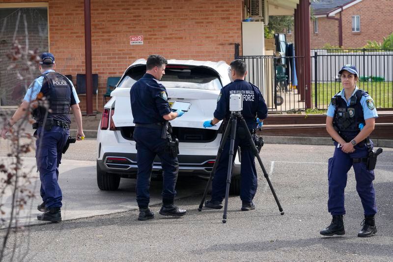 Police forensic officers work at a crime scene at the Christ the Good Shepherd church in suburban Wakely in western Sydney, Australia, Tuesday, April 16, 2024. Australian police say a knife attack in Sydney that wounded a bishop and a priest during a church service as horrified worshippers watched online and in person, and sparked a riot was an act of terrorism. (AP Photo/Mark Baker)