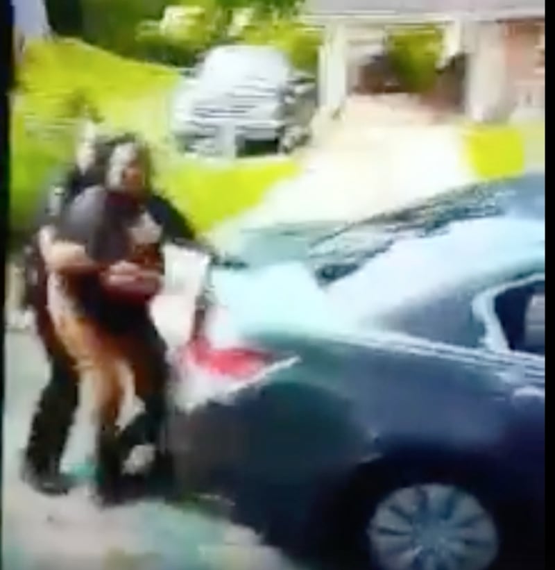 A screen grab of a video captured by a passerby shows the arrest of Breonna Bell.