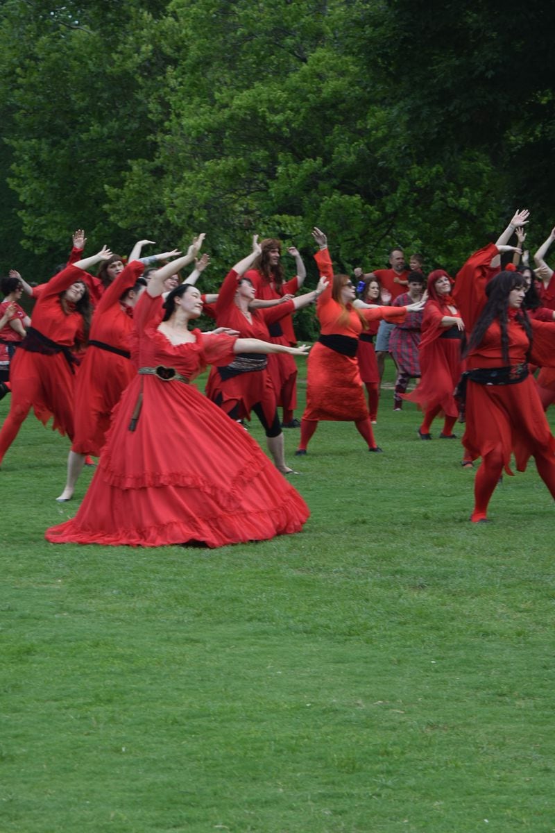 Fans of British musician Kate Bush gathered in cities all over the world in July 2016 to re-enact the video for her 1978 hit "Wuthering Heights." In the original video, Bush wore a black-belted red dress and dance in a field. Here's what it looked like in Atlanta's Candler Park. Photo by Shane Harrison/sharrison@ajc.com