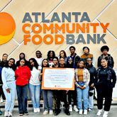 Members of the Southwest DeKalb tennis team participated in a volunteer project at the Atlanta Community Food Banki.