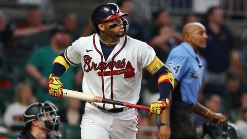 Braves designated hitter Ronald Acuna watches his home run leave the park against the Rockies on Wednesday night at Truist Park. (Curtis Compton / Curtis Compton@ajc.com)